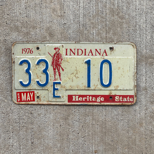 Photo of a 1977 Indiana License Plate Auto Tag Garage Decor Vintage Henry County Low Number 33 F 10 with original patina