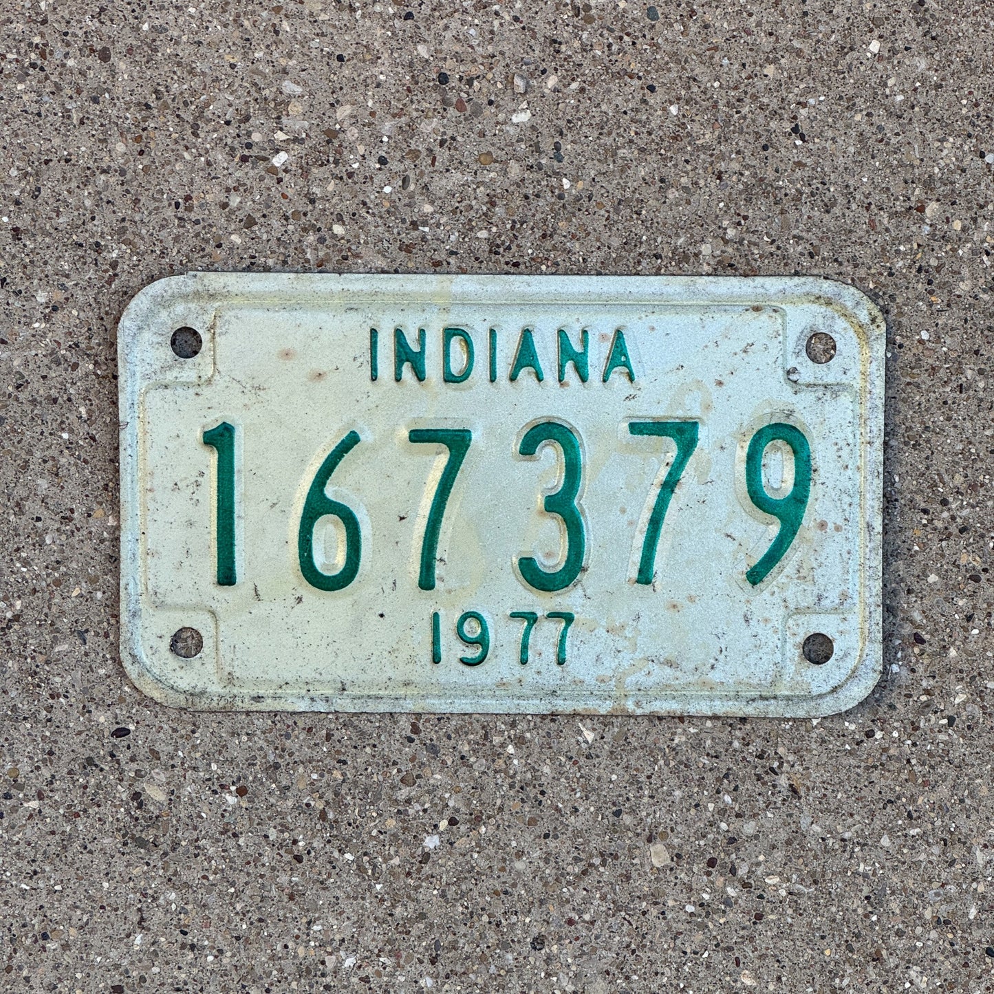 Photo of a 1977 Indiana Motorcycle License Plate Auto Tag Garage Decor Vintage 167379 with original patina