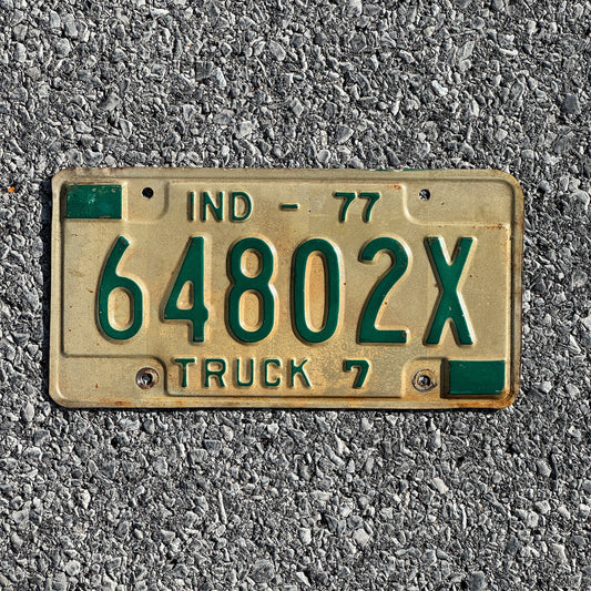 Photo of a 1977 Indiana Truck License Plate Auto Tag Garage Decor Vintage 64802X