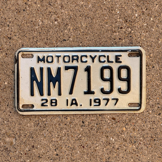 Photo of a 1977 Iowa Motorcycle License Plate Auto Tag Garage Decor Vintage NM 7199