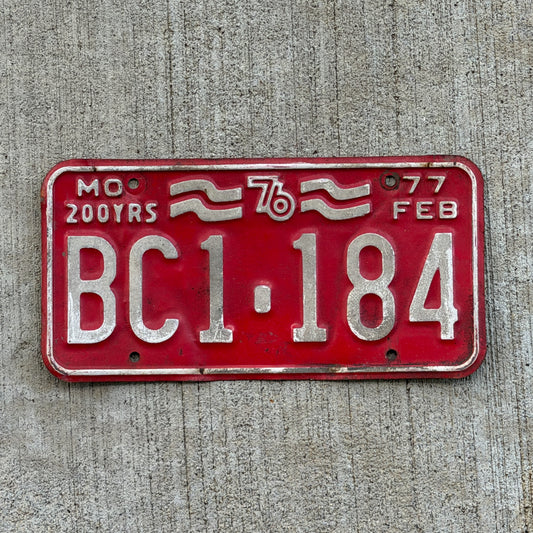 Photo of a 1977 Missouri License Plate Auto Tag Garage Decor Vintage Bicentennial BC1 184 with original patina