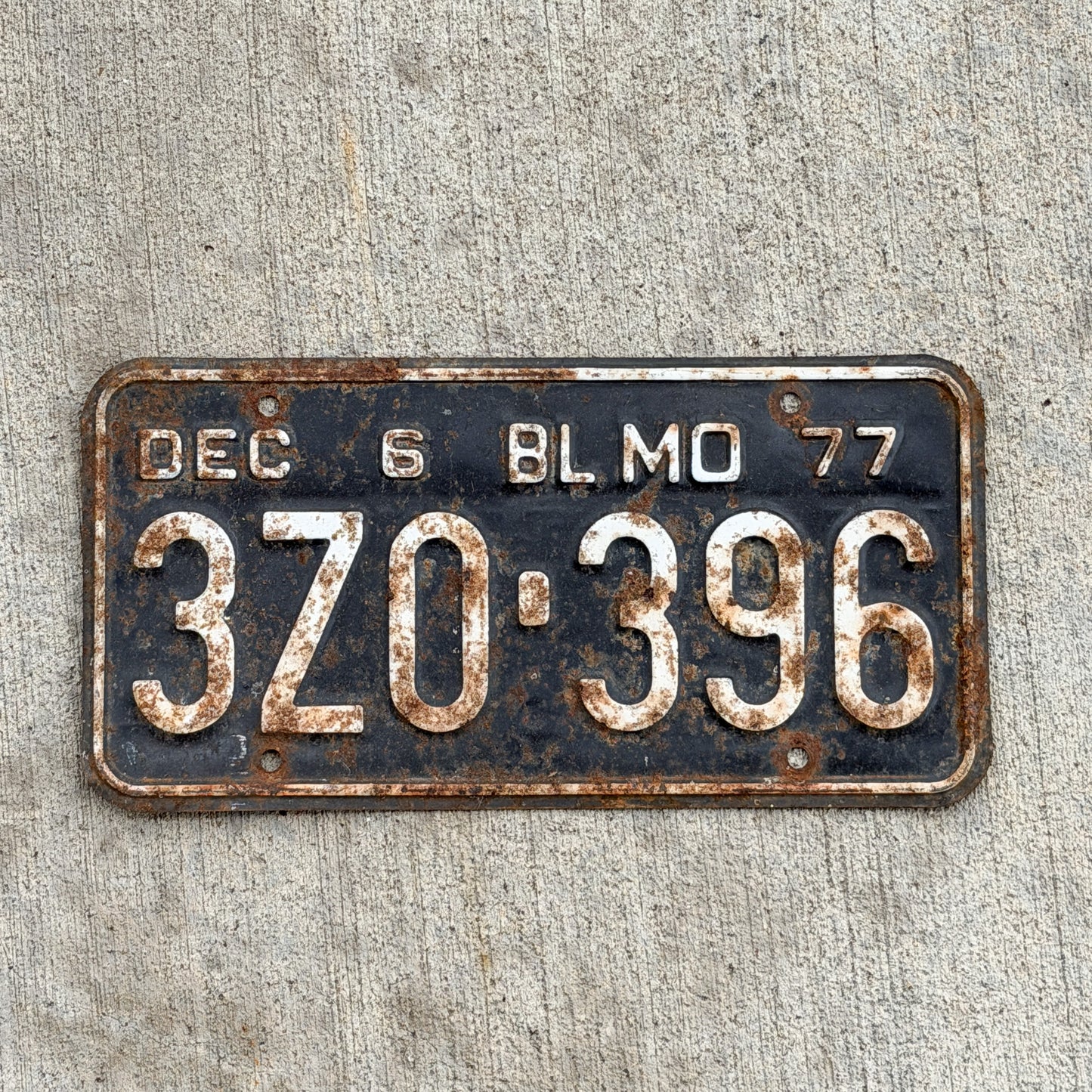 Photo of a 1977 Missouri Truck License Plate Auto Tag Garage Decor Vintage 3 ZO 396 with original patina