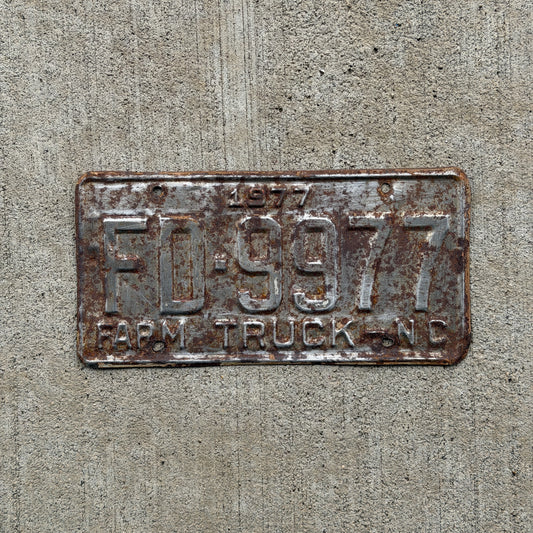 Photo of a 1977 North Carolina Farm Truck License Plate Auto Tag Garage Decor Vintage FD 9977 with original patina