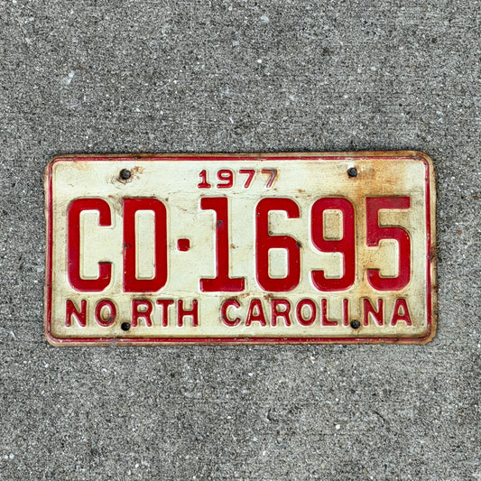 Photo of a 1977 North Carolina Truck License Plate Auto Tag Garage Decor Vintage CD 1695 with original patina