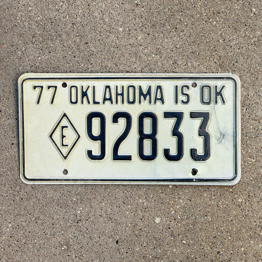 Photo of a 1977 Oklahoma Exempt License Plate Auto Tag Garage Decor Vintage Diamond E Fire State Police 92833 with original patina