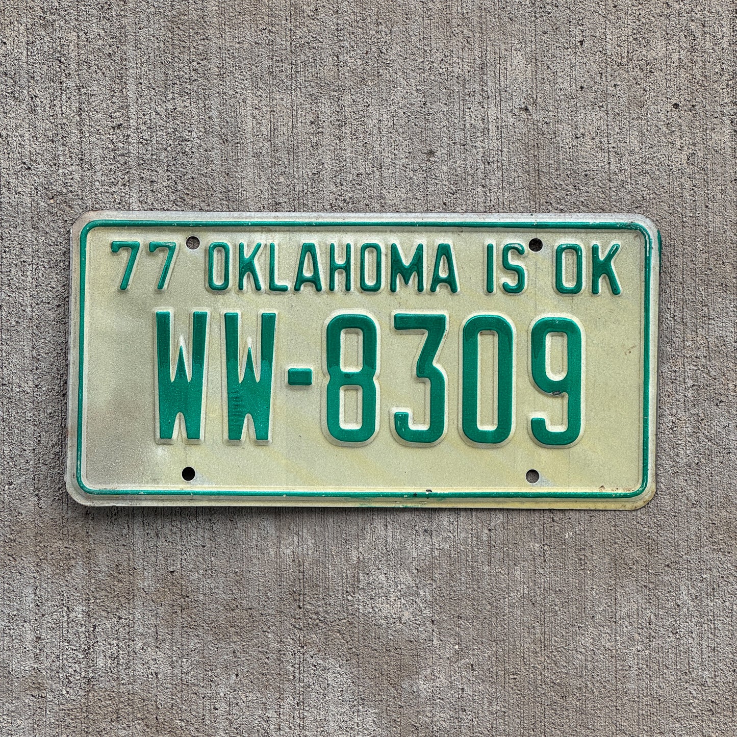 Photo of a 1977 Oklahoma License Plate Auto Tag Garage Decor Vintage WW 8309 with original patina