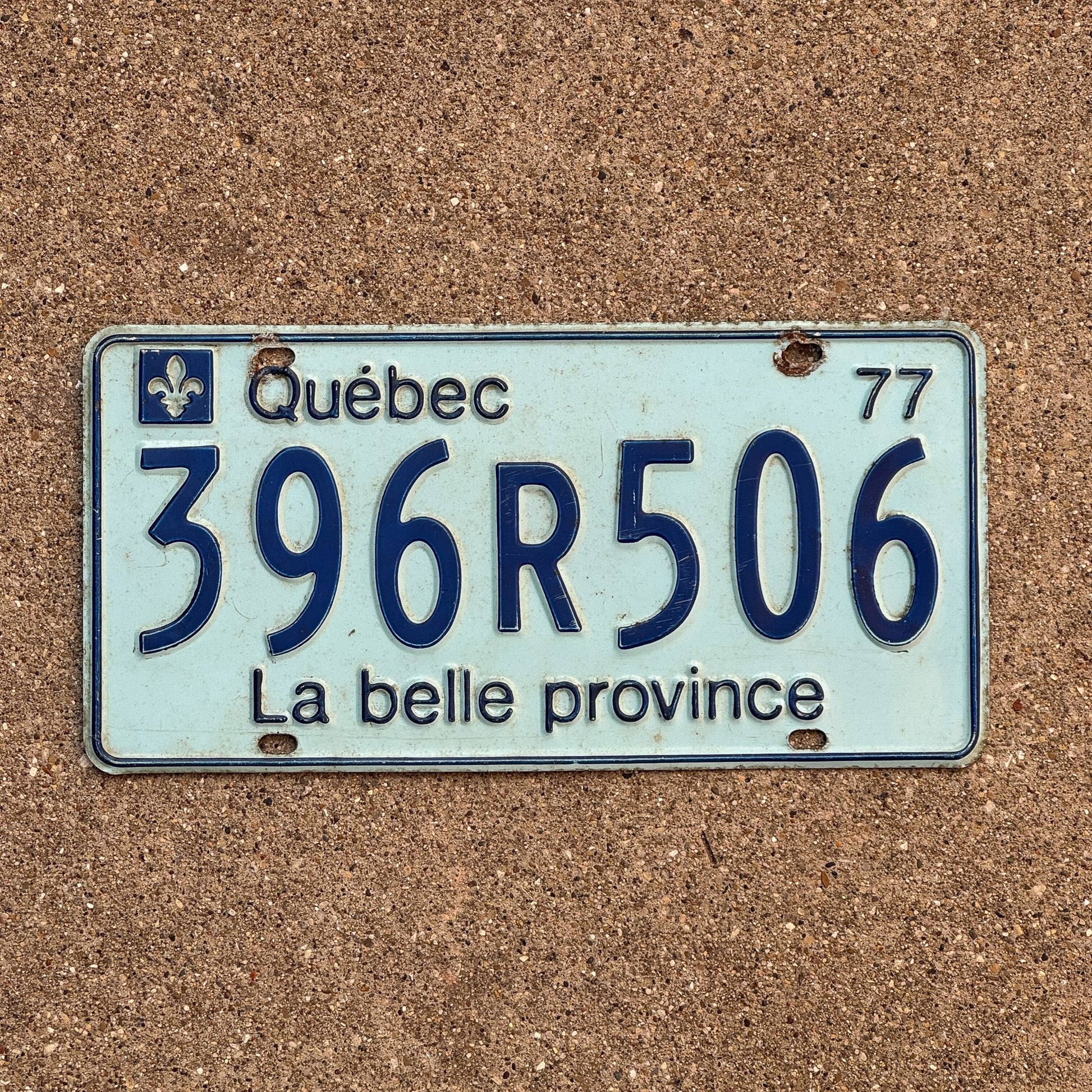 Photo of a 1977 Quebec License Plate Auto Tag Garage Decor Vintage 396 R 506
