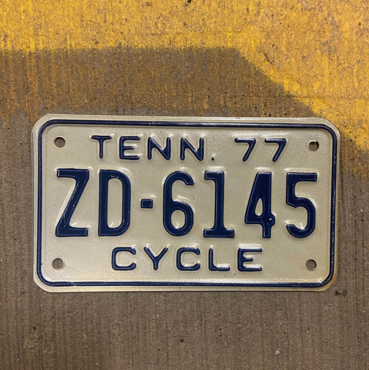Photo of a 1977 Tennessee Motorcycle License Plate Auto Tag Garage Decor Vintage ZD 6145 with original patina