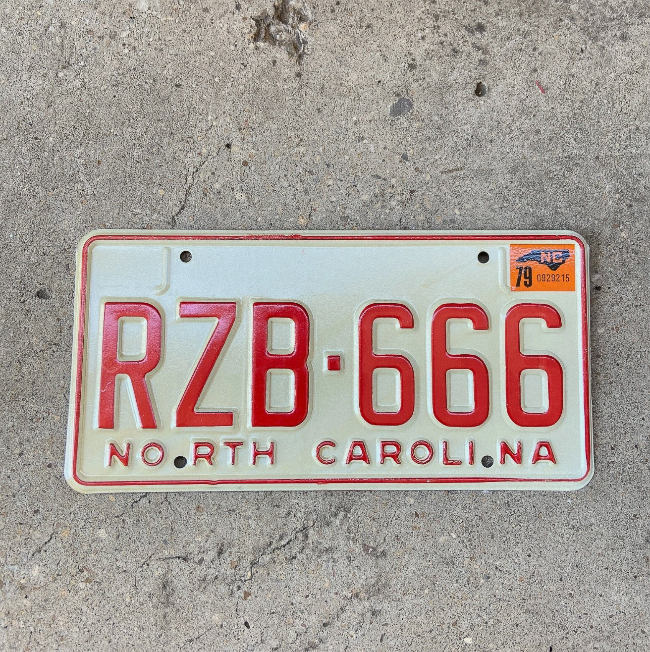 Photo of a 1978 1979 North Carolina License Plate Auto Tag Garage Decor Vintage Devil Evil Repeat Repeating High Quality RZB 666 with original patina