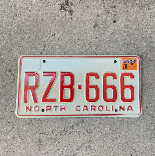 Photo of a 1978 1979 North Carolina License Plate Auto Tag Garage Decor Vintage Devil Evil Repeat Repeating High Quality RZB 666 with original patina