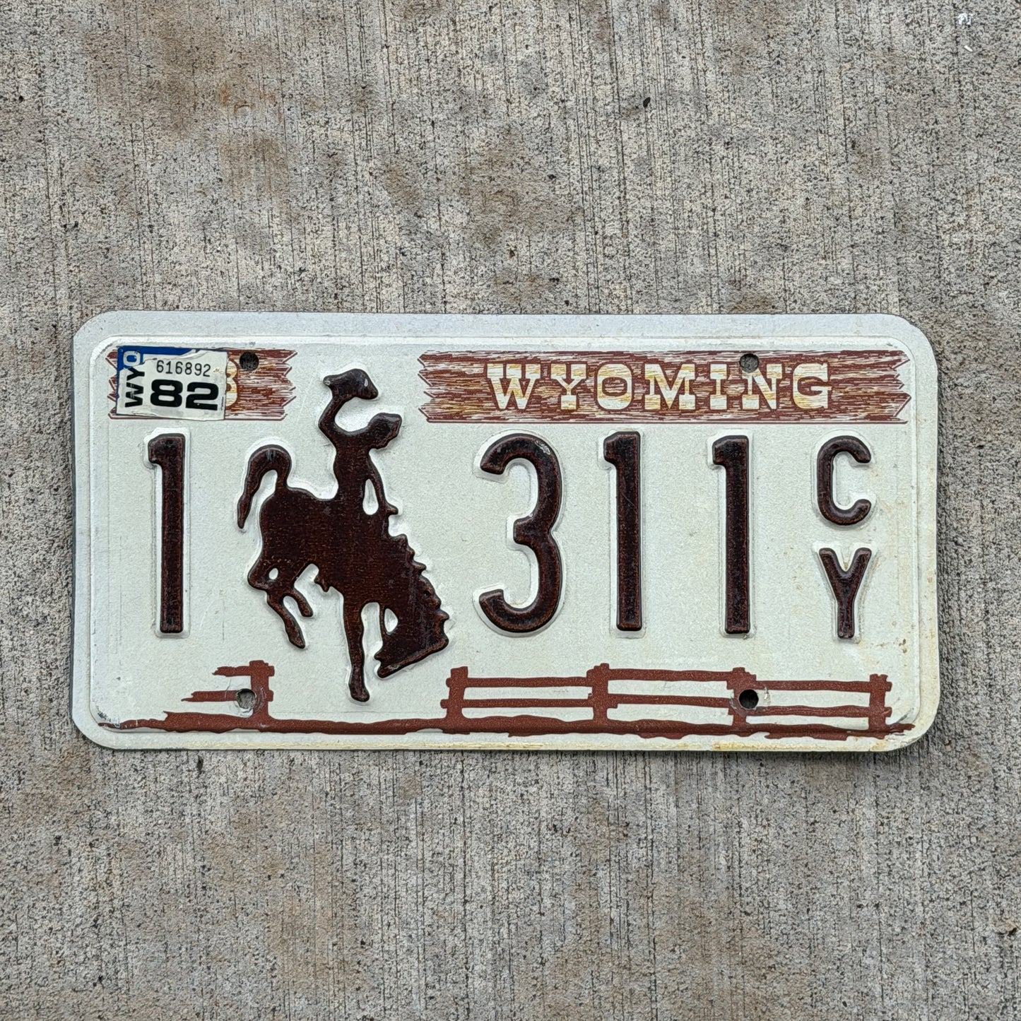 Photo of a 1978 1982 Wyoming License Plate Auto Tag Garage Decor Vintage Cowboy Rodeo 1 311 CY with original patina