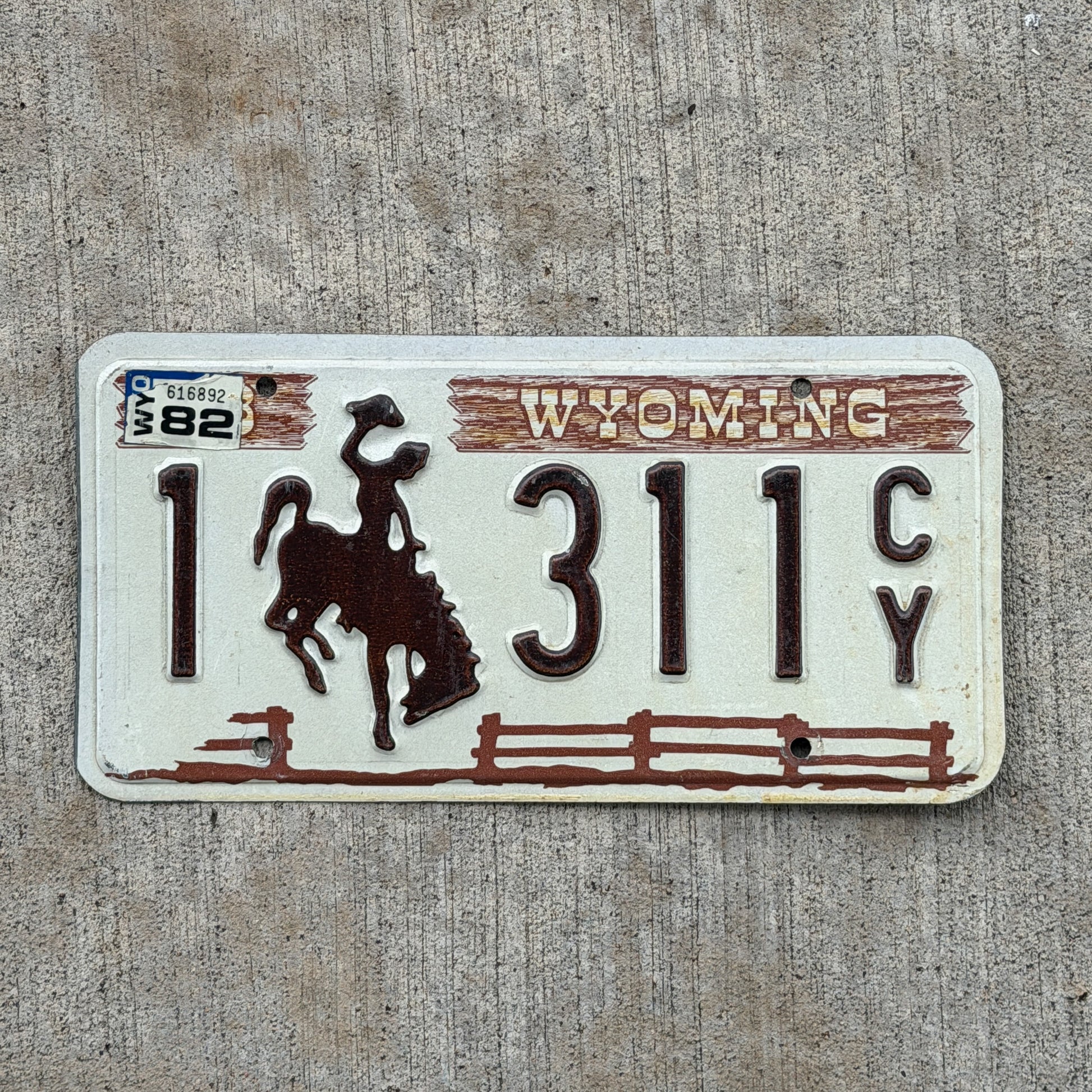 Photo of a 1978 1982 Wyoming License Plate Auto Tag Garage Decor Vintage Cowboy Rodeo 1 311 CY with original patina