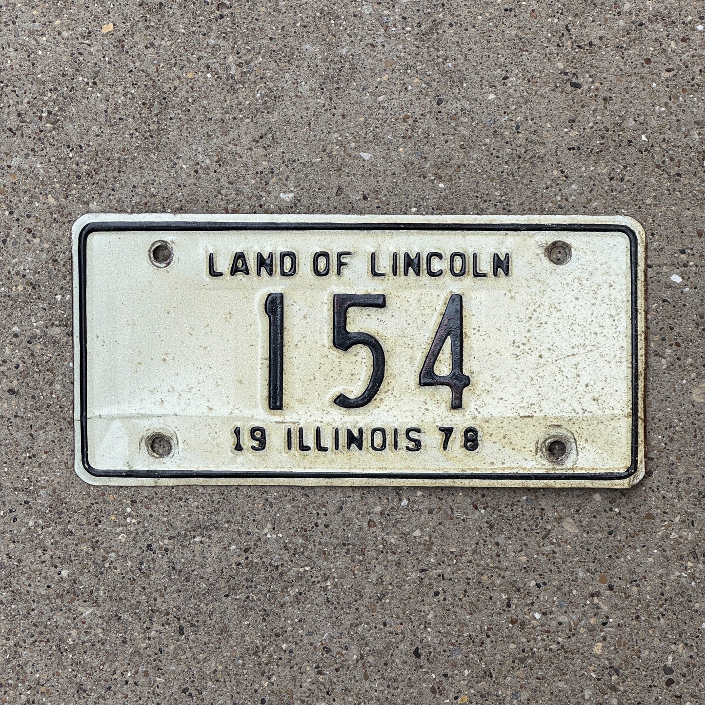Photo of a 1978 Illinois Motorcycle License Plate Auto Tag Garage Decor Vintage Low Number Three Digit 154 with original patina