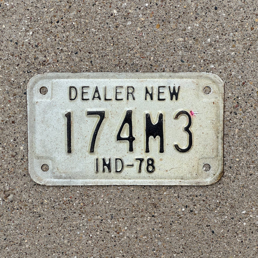 Photo of a 1978 Indiana Motorcycle Dealer License Plate Auto Tag Garage Decor Vintage 174 M 3 with original patina
