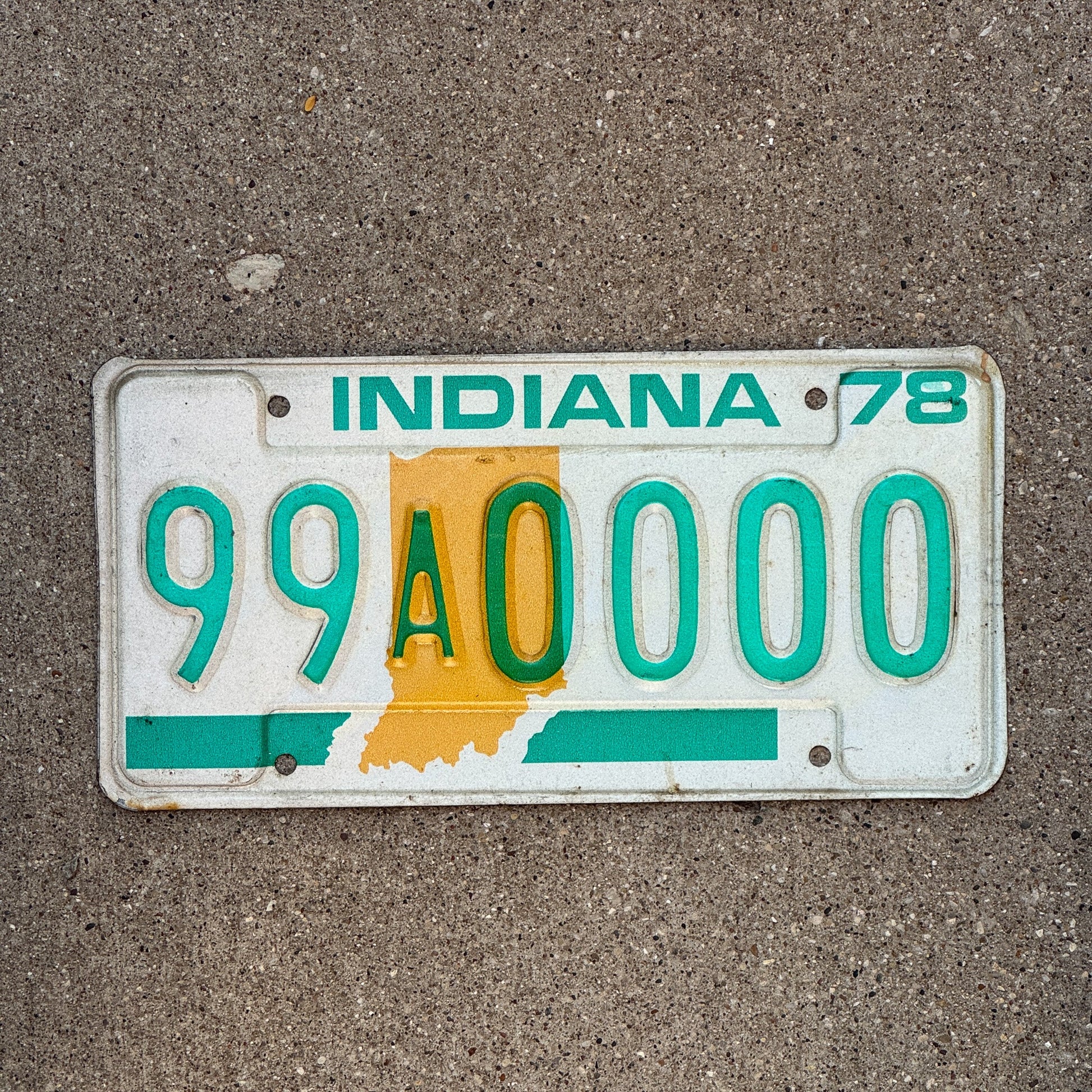 Photo of a 1978 Indiana Sample License Plate Auto Tag 3 Vintage 99A0000 with original patina