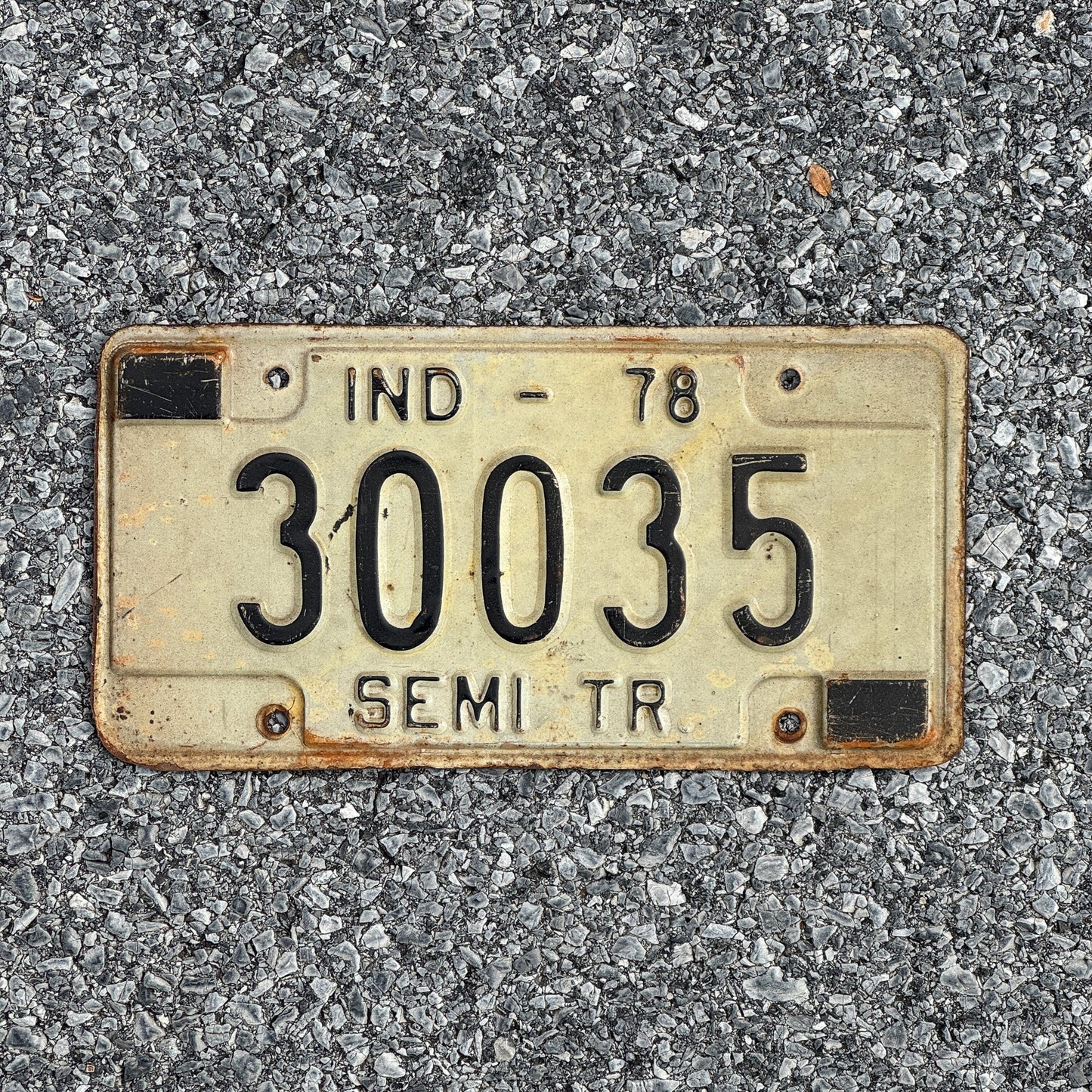 Photo of a 1978 Indiana Semi Trailer License Plate Auto Tag Garage Decor Vintage 30035