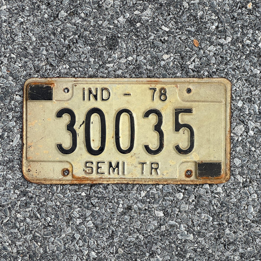 Photo of a 1978 Indiana Semi Trailer License Plate Auto Tag Garage Decor Vintage 30035