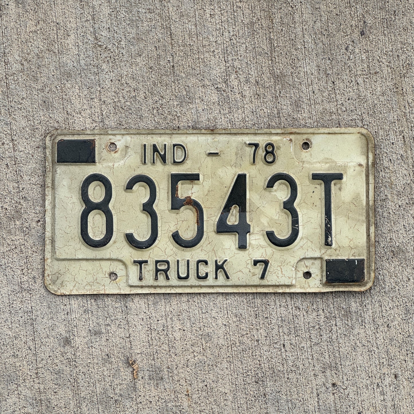 Photo of a 1978 Indiana Truck License Plate Auto Tag Garage Decor Vintage 83543 T with original patina