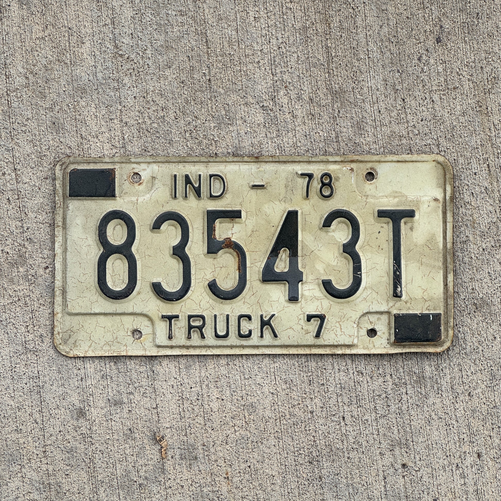 Photo of a 1978 Indiana Truck License Plate Auto Tag Garage Decor Vintage 83543 T with original patina
