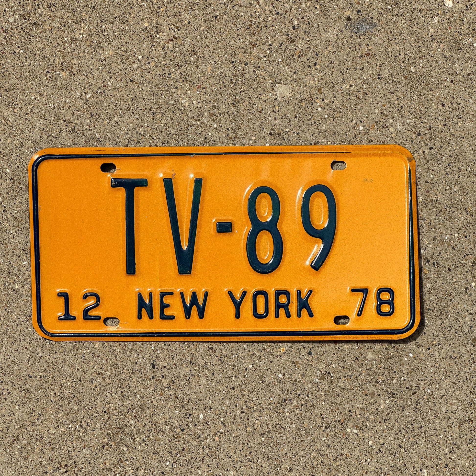 Photo of a 1978 New York Television License Plate Auto Tag Garage Decor Vintage TV 89
