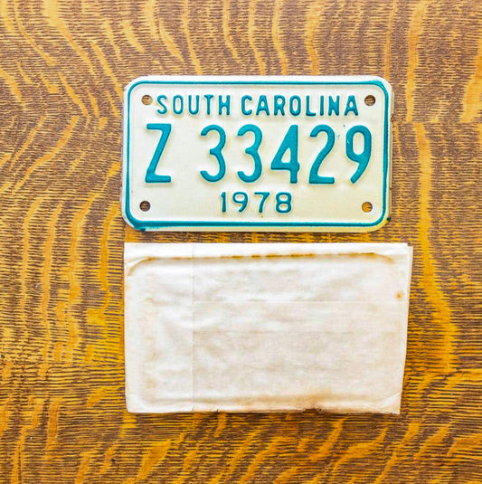 Photo of a 1978 South Carolina Motorcycle License Plate Auto Tag Garage Decor Vintage With Sleeve Z 33429 with original patina