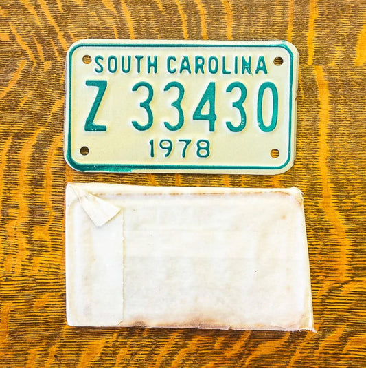 Photo of a 1978 South Carolina Motorcycle License Plate Auto Tag Garage Decor Vintage With Sleeve Z 33430 with original patina