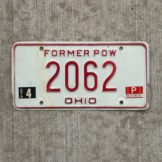 Photo of a 1979 1980 Ohio Ex Prisoner of War License Plate Auto Tag Garage Decor Vintage 2062 with original patina