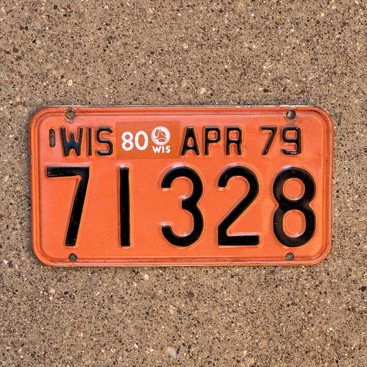 Photo of a 1979 1980 Wisconsin Motorcycle License Plate Auto Tag Garage Decor Vintage Orange Black 71328