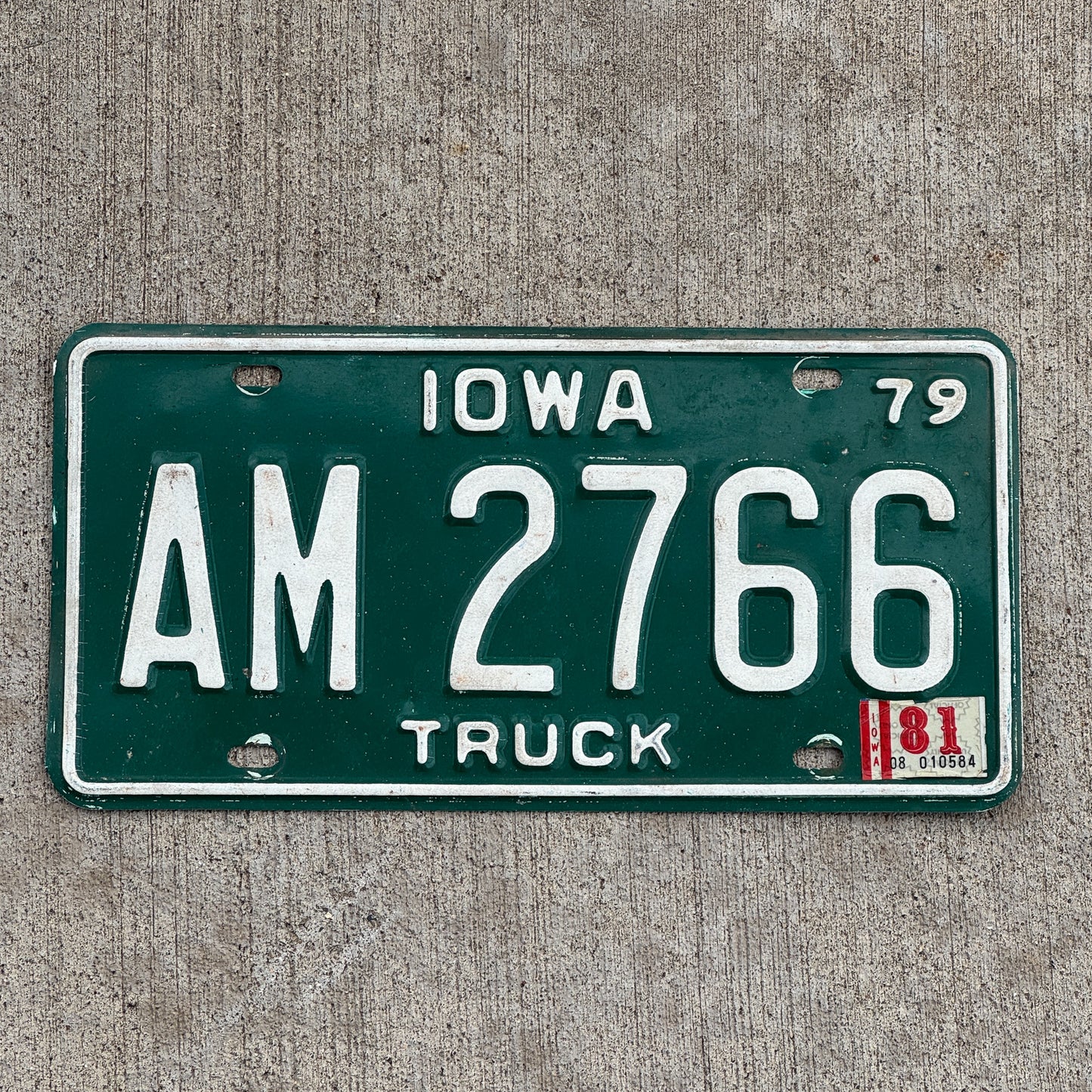 Photo of a 1979 1981 Iowa Truck License Plate Auto Tag Garage Decor Vintage AM 2766 with original patina