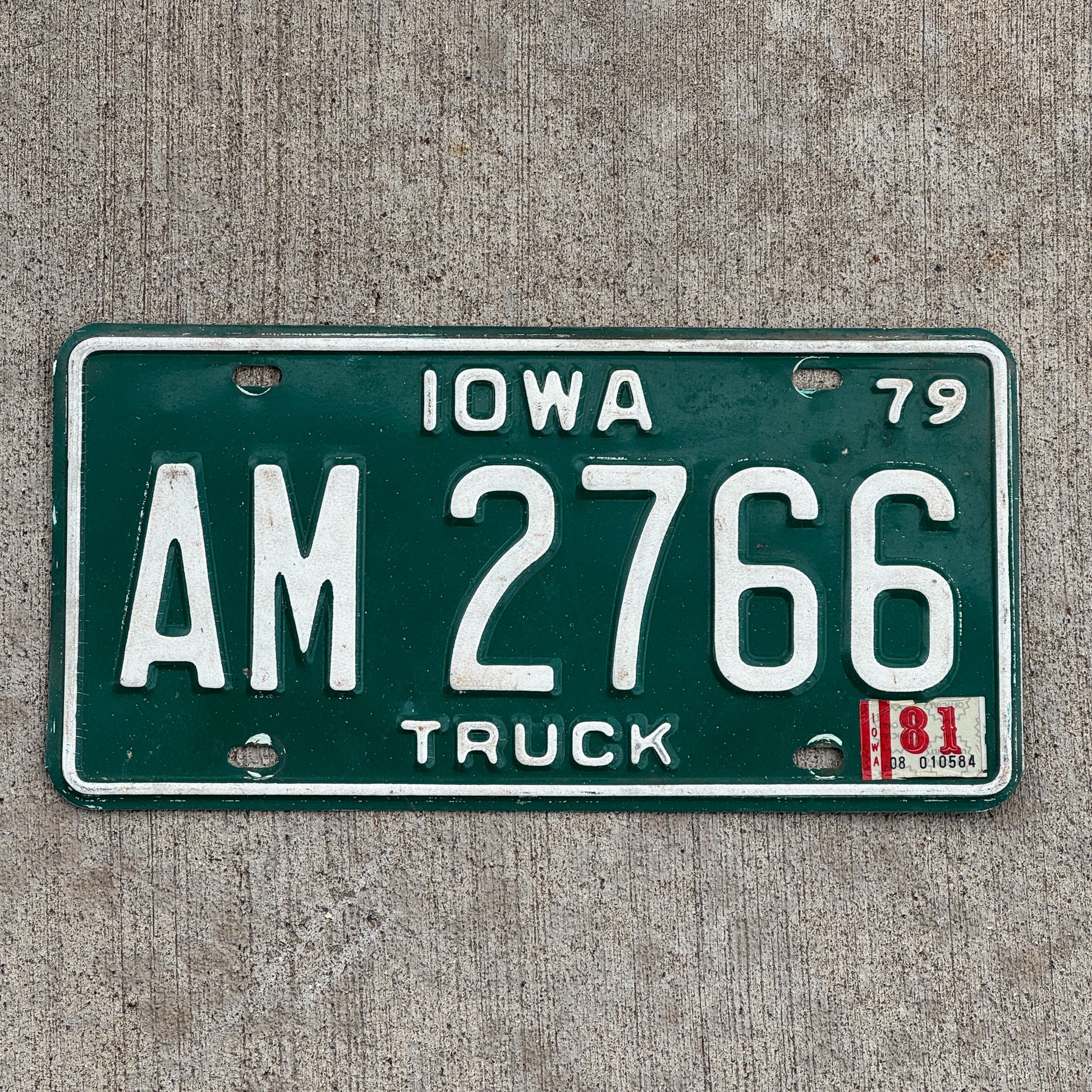 Photo of a 1979 1981 Iowa Truck License Plate Auto Tag Garage Decor Vintage AM 2766 with original patina