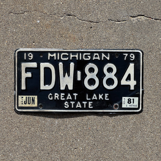 Photo of a 1979 1981 Michigan License Plate Auto Tag Garage Decor Vintage FDW 884 with original patina