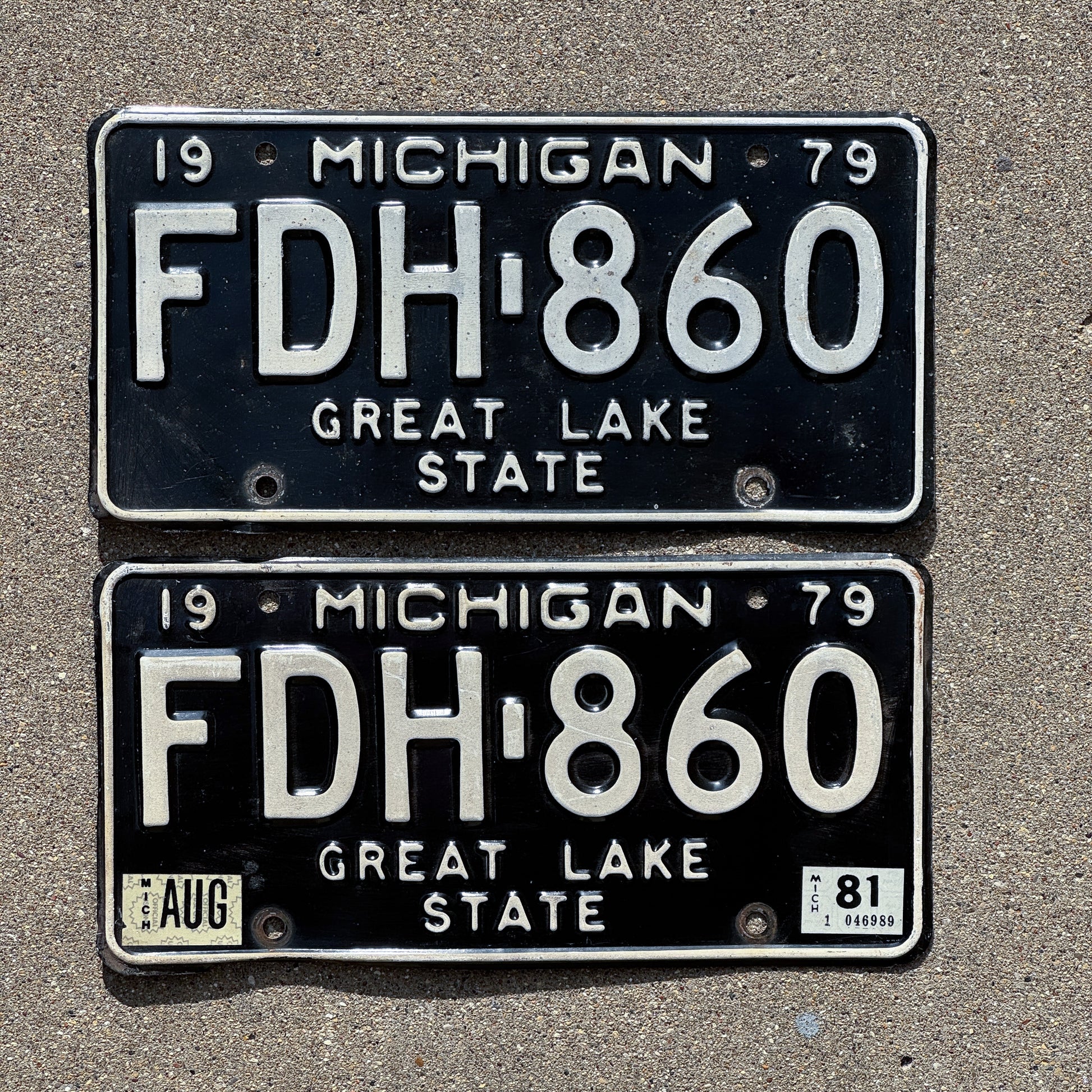 Photo of a 1979 1981 Michigan License Plate Pair Auto Tag Garage Decor Vintage FDH 860 with original patina
