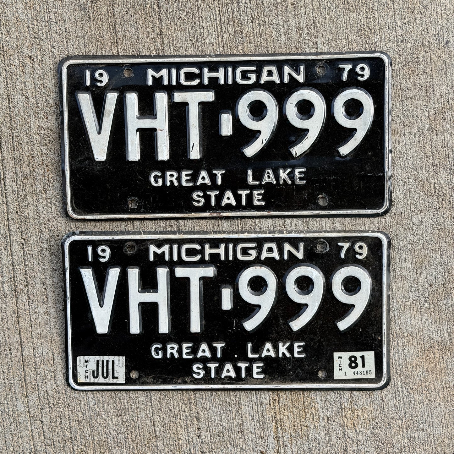 Photo of a 1979 1981 Michigan License Plate Pair Auto Tag Garage Decor Vintage Repeat Repeating VHT 999 with original patina