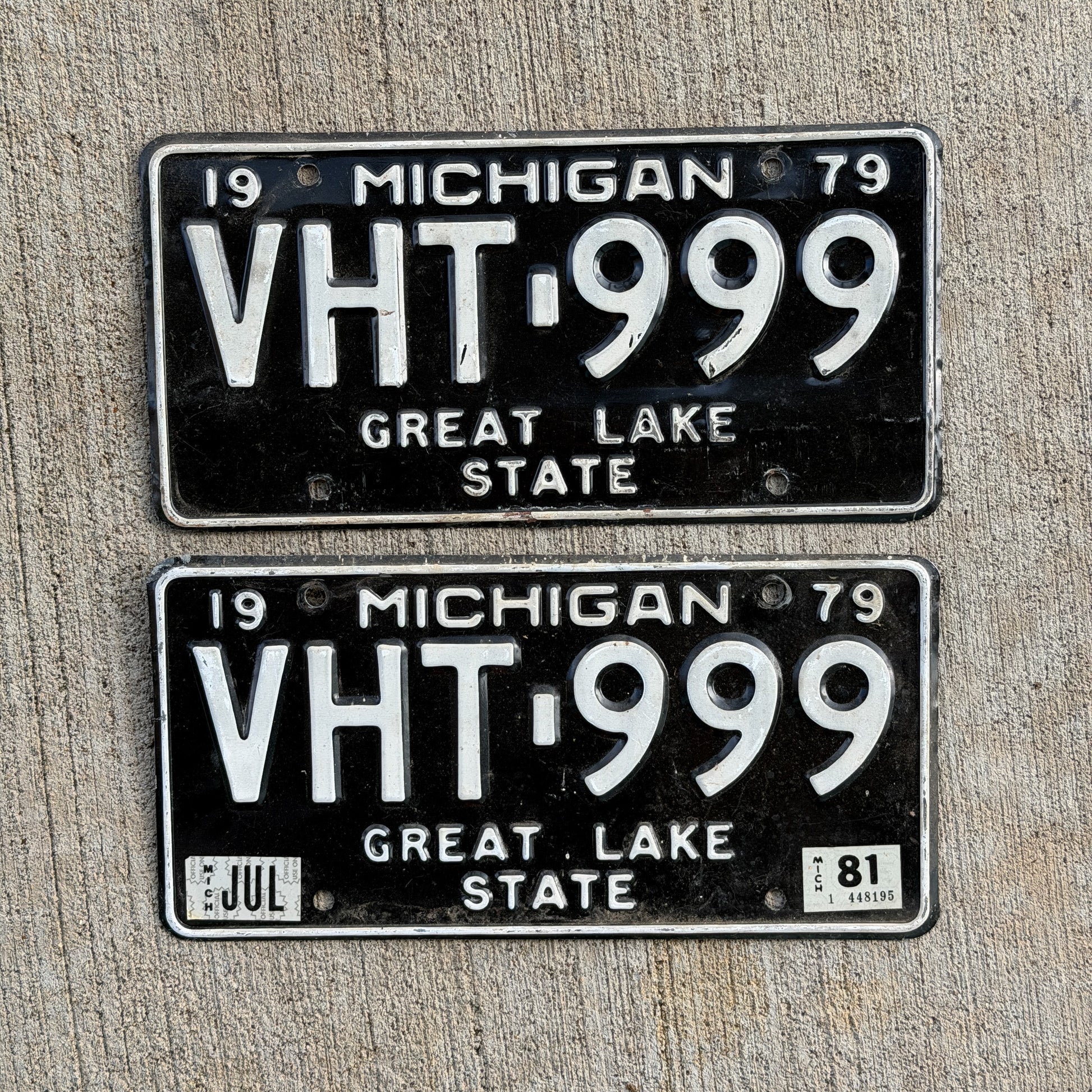 Photo of a 1979 1981 Michigan License Plate Pair Auto Tag Garage Decor Vintage Repeat Repeating VHT 999 with original patina