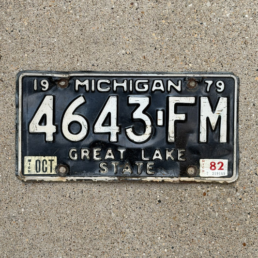 Photo of a 1979 1982 Michigan Commercial License Plate Auto Tag Garage Decor Vintage 4643 FM with original patina