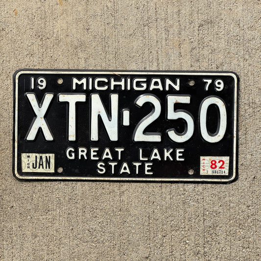 Photo of a 1979 1982 Michigan License Plate Auto Tag Garage Decor Vintage XTN 250