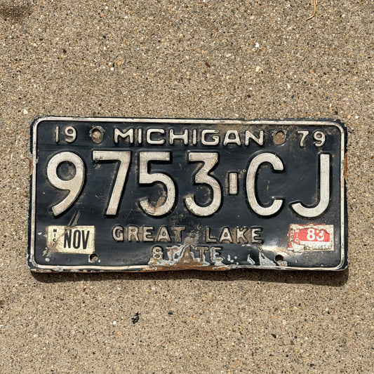 Photo of a 1979 1983 Michigan Commercial License Plate Auto Tag Garage Decor Vintage 9753 CJ with original patina