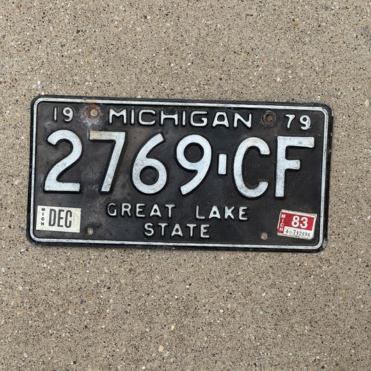 Photo of a 1979 1983 Michigan Commercial Truck License Plate Auto Tag Garage Decor Vintage 2769 CF