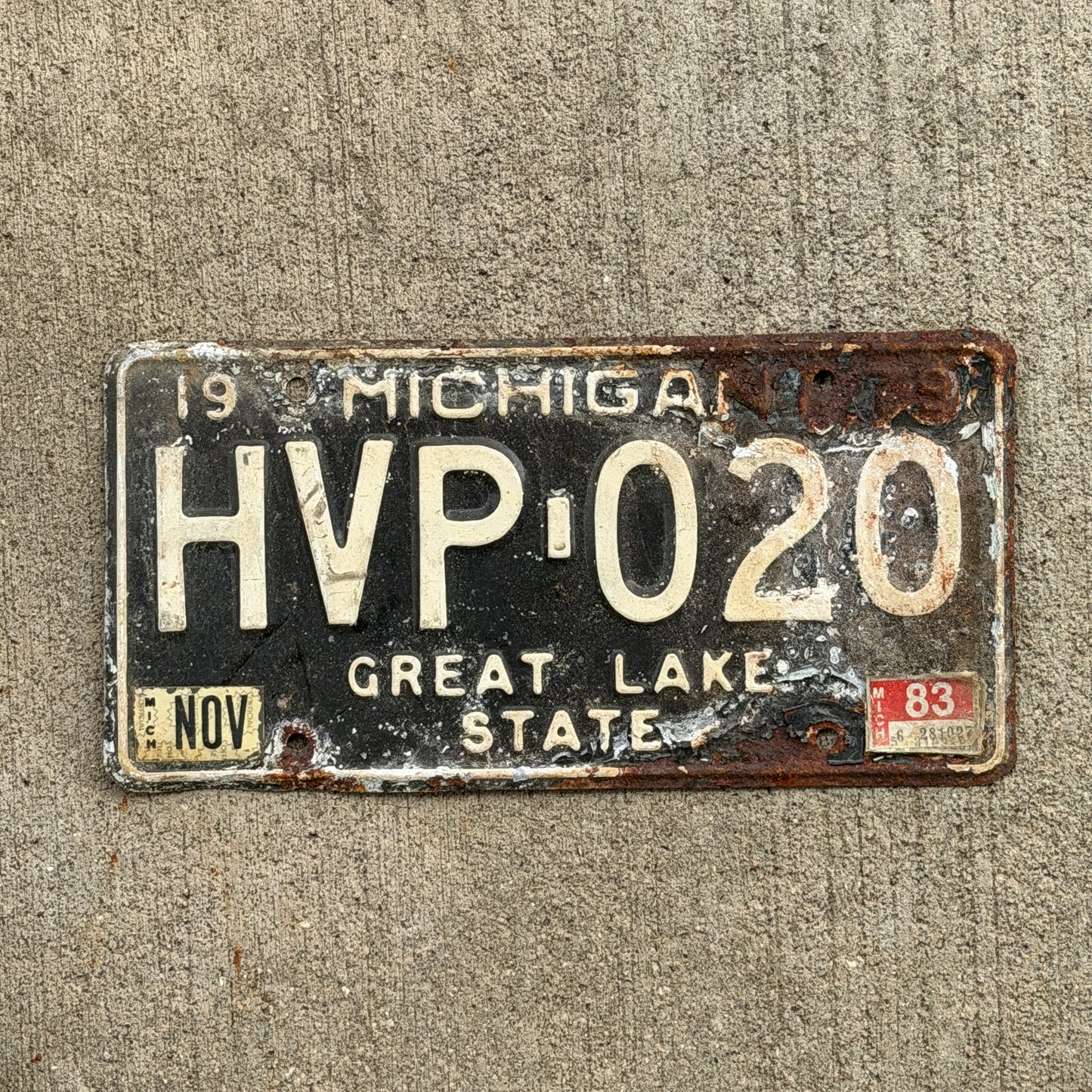 Photo of a 1979 1983 Michigan License Plate Auto Tag Garage Decor Vintage HVP 020 with original patina