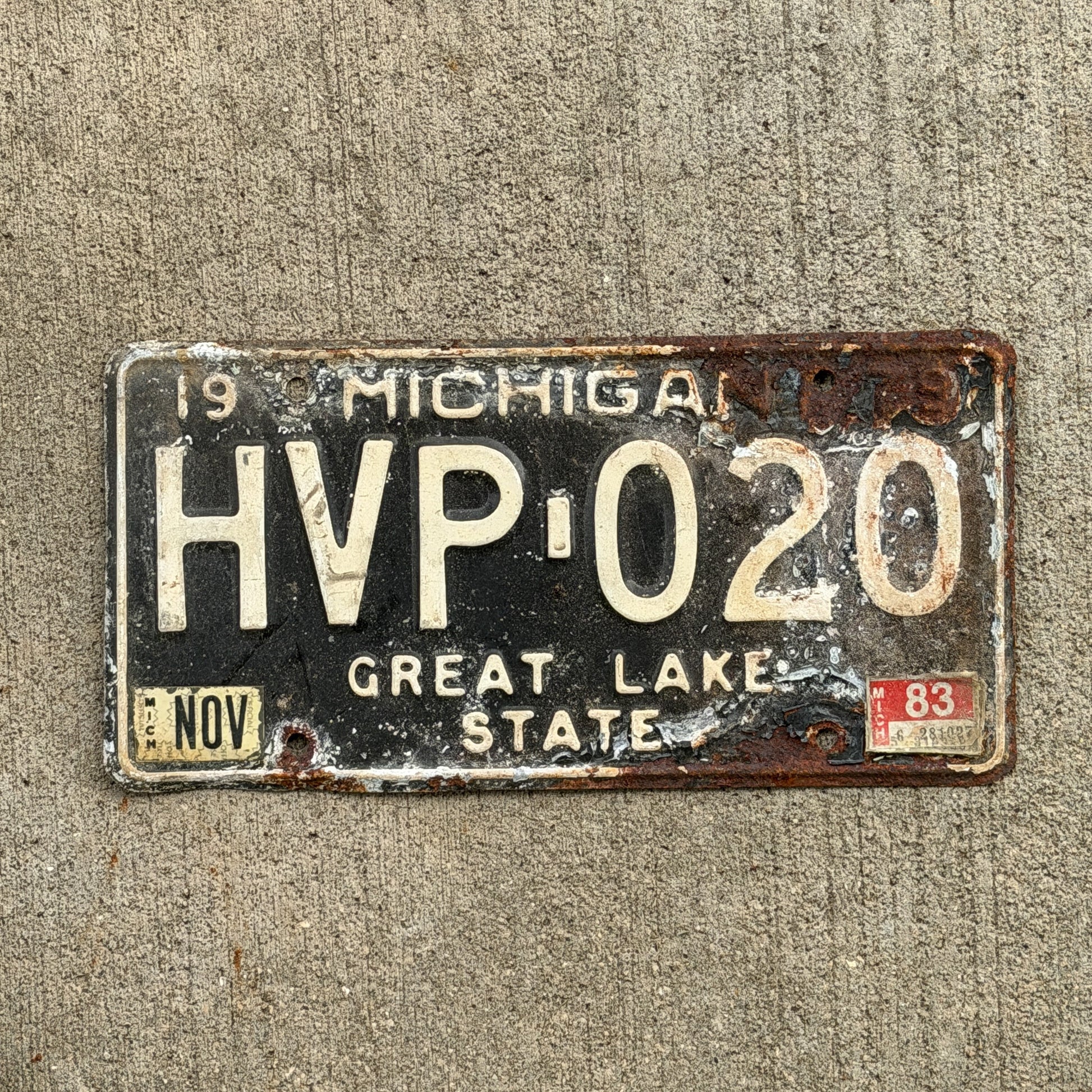 Photo of a 1979 1983 Michigan License Plate Auto Tag Garage Decor Vintage HVP 020 with original patina