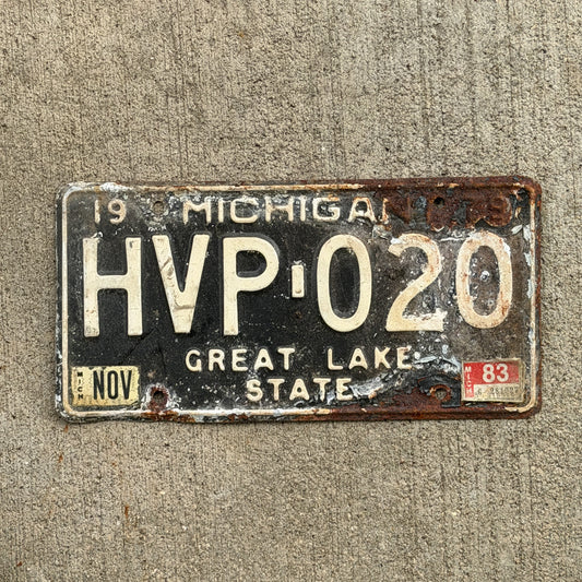 Photo of a 1979 1983 Michigan License Plate Auto Tag Garage Decor Vintage HVP 020 with original patina