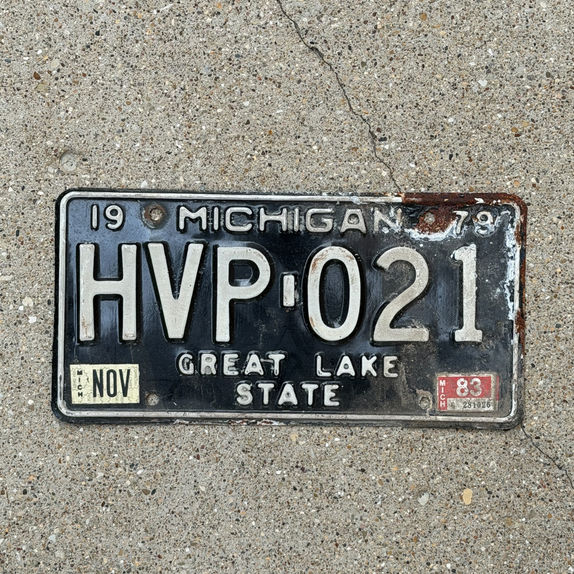 Photo of a 1979 1983 Michigan License Plate Auto Tag Garage Decor Vintage HVP 021 with original patina