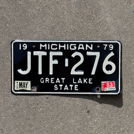 Photo of a 1979 1983 Michigan License Plate Auto Tag Garage Decor Vintage JTF 276 with original patina