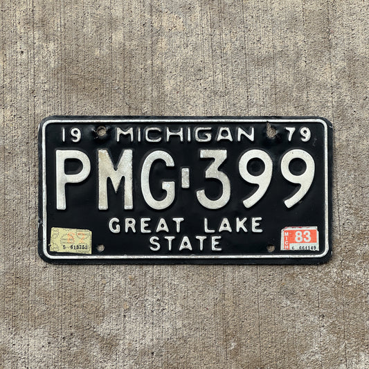 Photo of a 1979 1983 Michigan License Plate Auto Tag Garage Decor Vintage PMG 399 with original patina