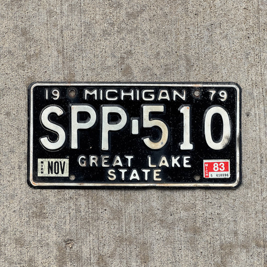 Photo of a 1979 1983 Michigan License Plate Auto Tag Garage Decor Vintage SPP 510 with original patina