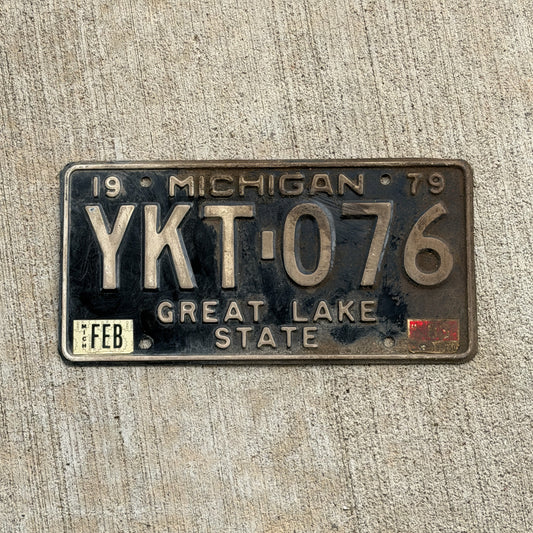 Photo of a 1979 1983 Michigan License Plate Auto Tag Garage Decor Vintage YKT 076 with original patina