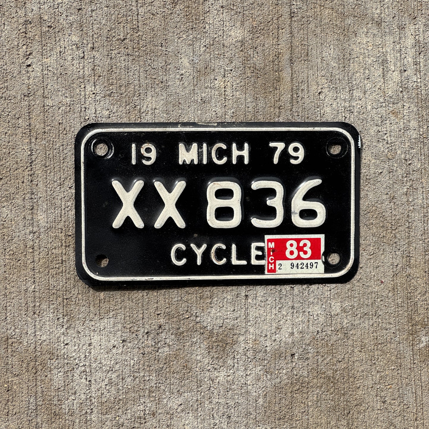 Photo of a 1979 1983 Michigan Motorcycle License Plate Auto Tag Garage Decor Vintage XX 836 with original patina