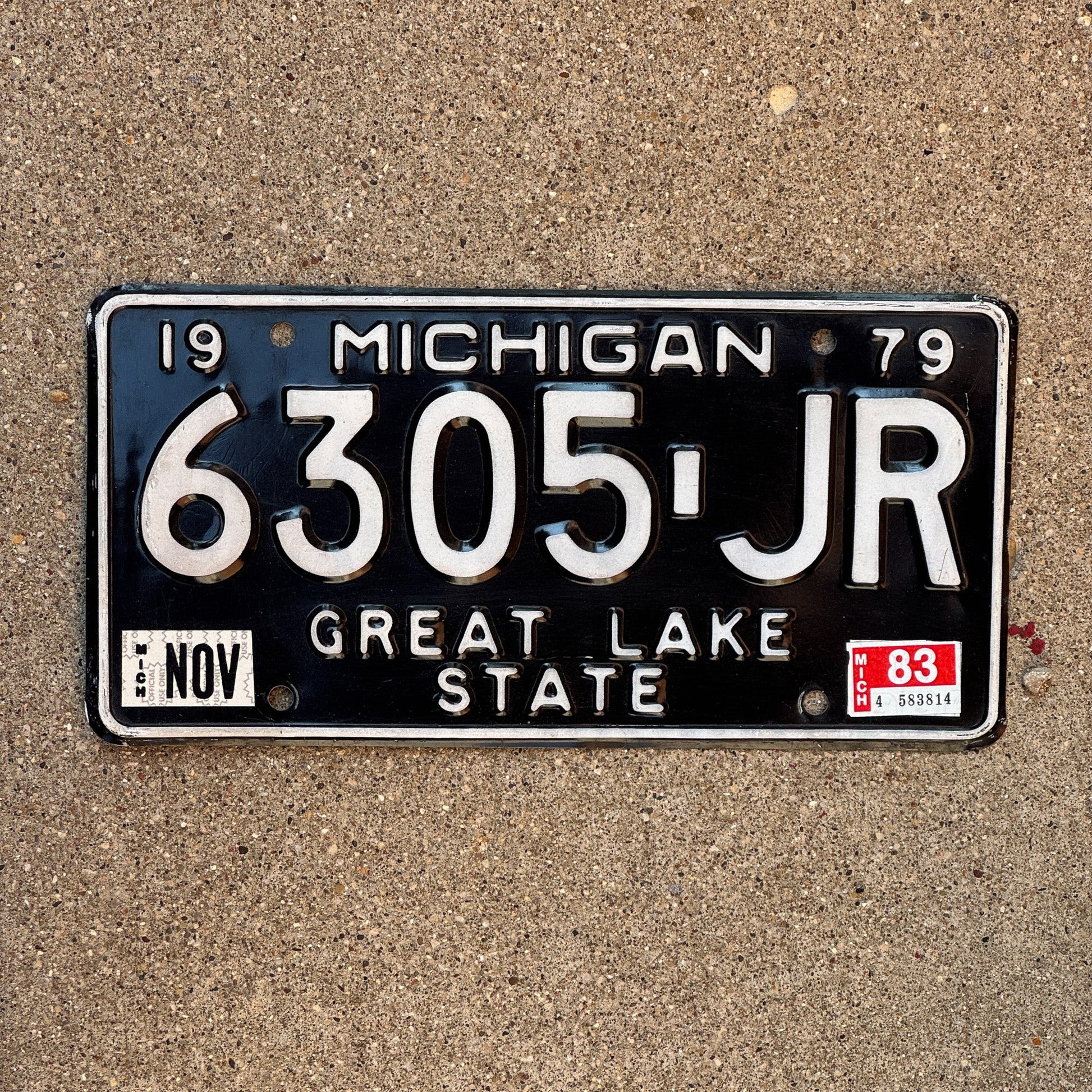 Photo of a 1979 1983 Michigan Truck License Plate Auto Tag Garage Decor Vintage 6305 JR