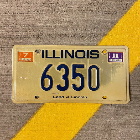 Photo of a 1979 1984 Illinois License Plate Auto Tag Garage Decor Vintage Low Number Four Digit 6350 with original patina