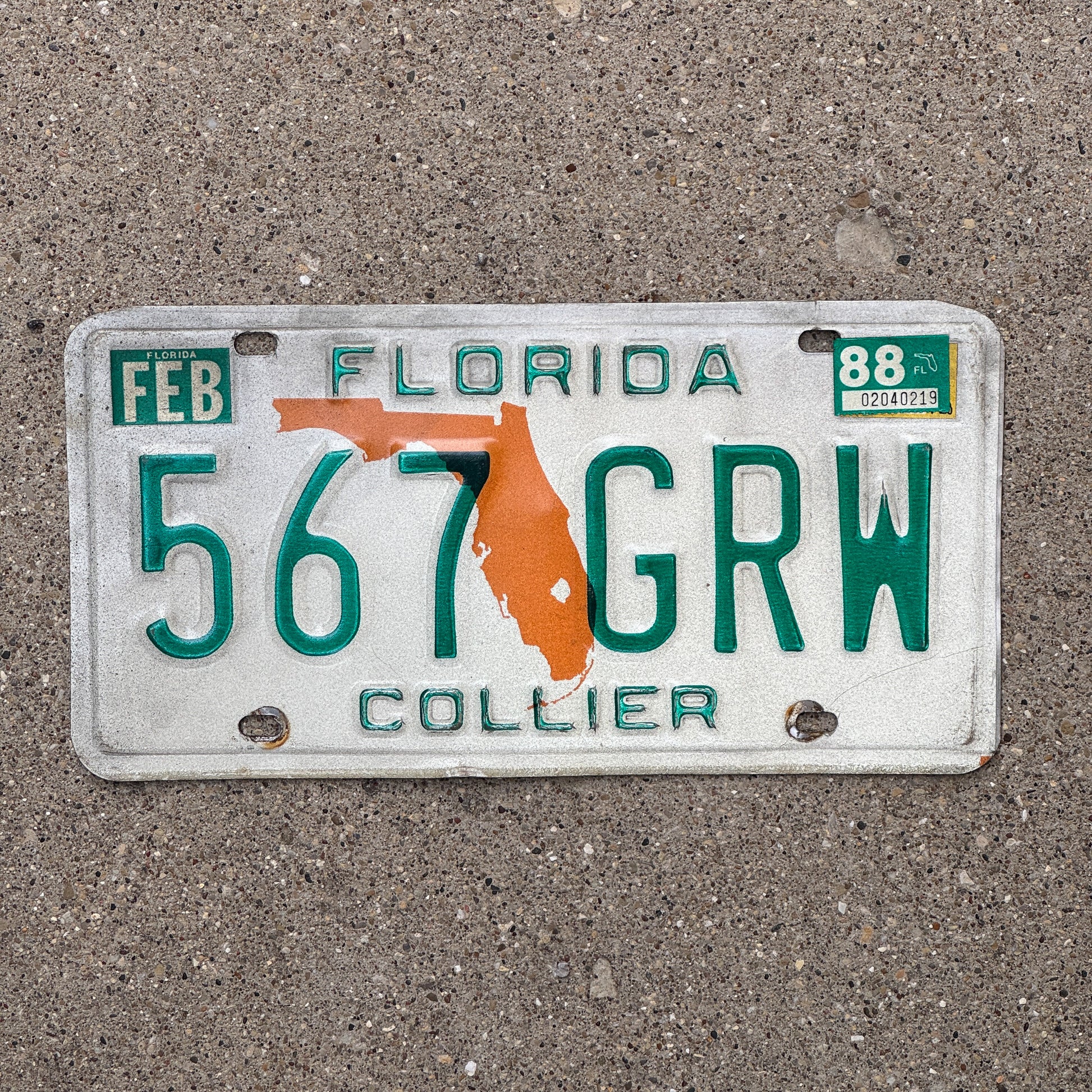 Photo of a 1979 1988 Florida License Plate Auto Tag Garage Decor Vintage 567 GRW with original patina